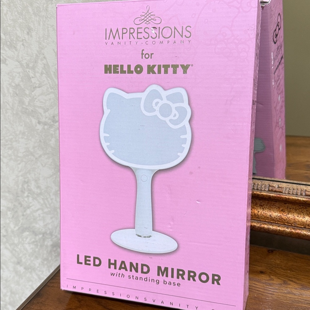Hello Kitty light up LED Hand Mirror with stand. Rechargeable for cordless use.